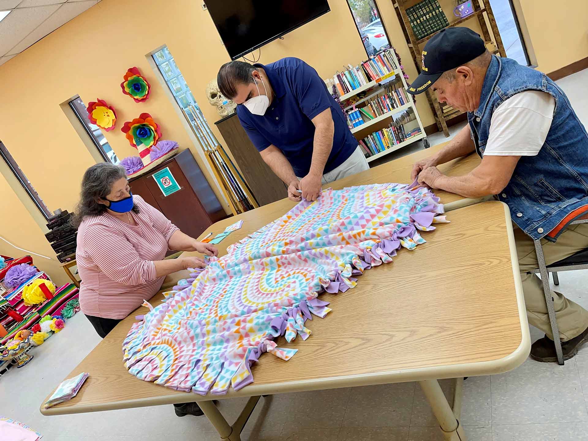 LA SED seniors and staff collaborate with World Medical Relief to make baby blankets